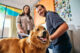 Canine Coach conducting a Dogtopia meet and greet with a new dog at Dogtopia of Viera