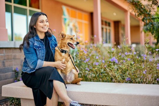 Pet parent and dog outside of Dogtopia dog daycare